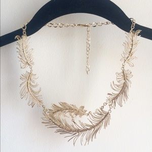 Leaf inspired feather silver tone bib necklace